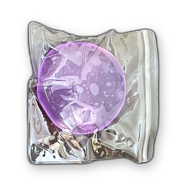 Purple Squishlotte Original Squishy in its clear bag.